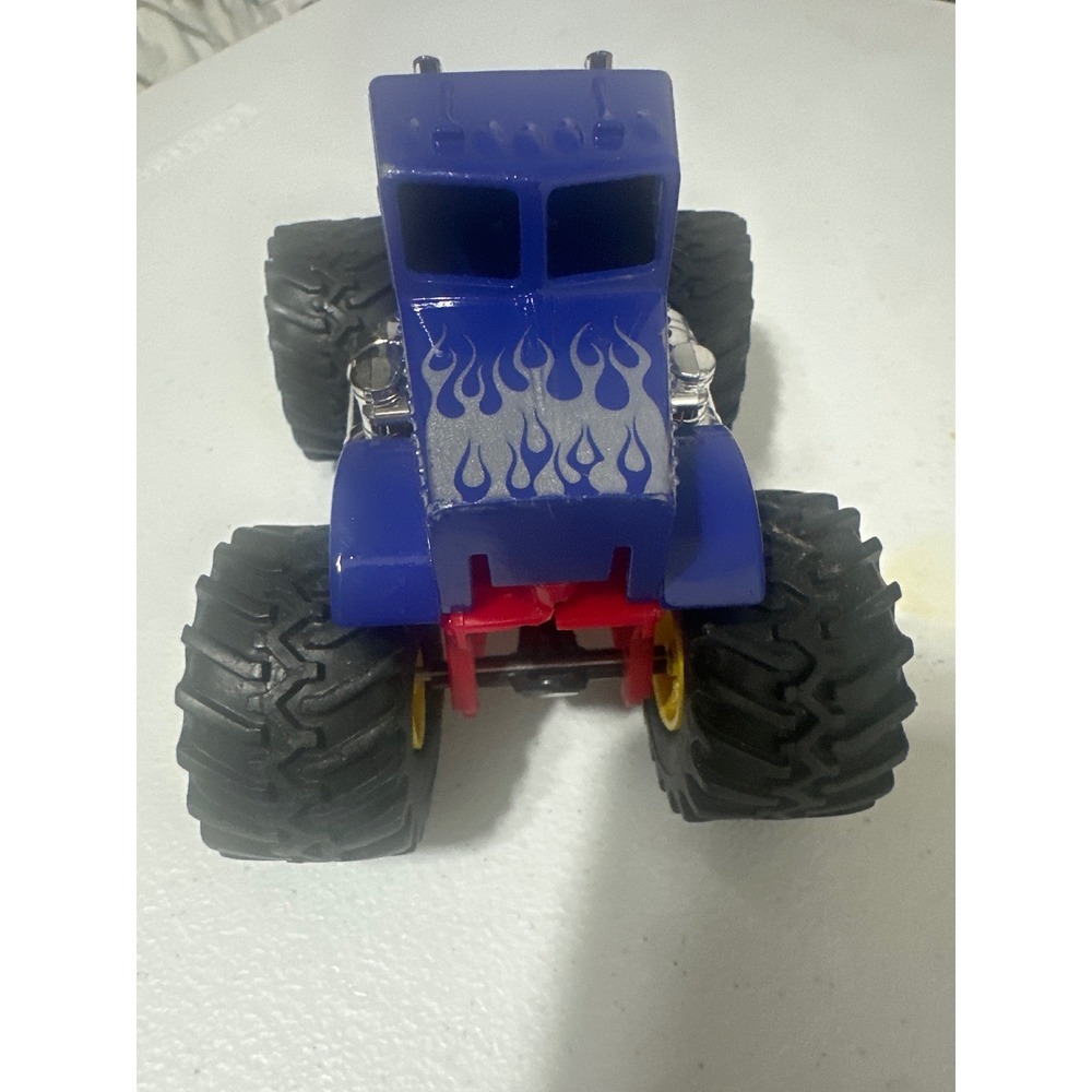 New Ray Peterbilt Monster Truck Blue with Silver Flames Red Chassis Toy